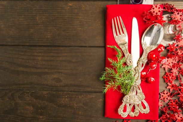 istock Holiday table setting with red color on wooden table 1072905582