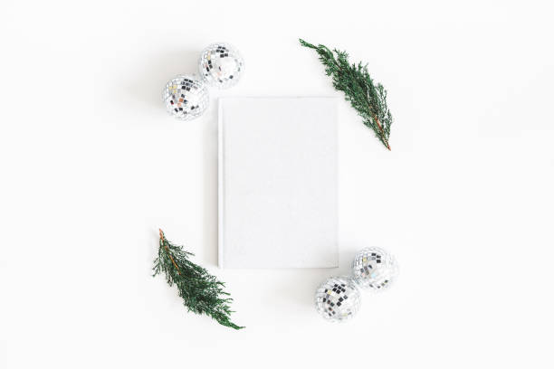 istock Christmas composition. Fir tree branches, notebook on white background. Christmas, winter, new year concept. Flat lay, top view, copy space 1072910198