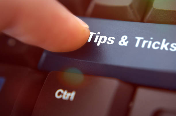 Tips & Tricks Icon Concept on the Blue Keyboard Button Guide, Working, Turkey - Middle East, Advice, Tip magic trick stock pictures, royalty-free photos & images