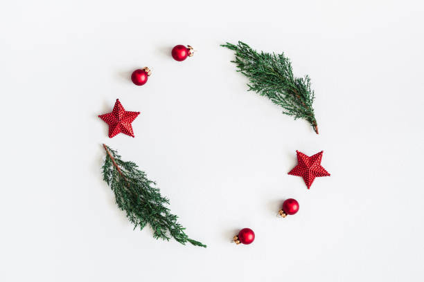 istock Christmas composition. Wreath made of coniferous tree branches, balls, pine cones on pastel gray background. Christmas, winter, new year concept. Flat lay, top view, copy space 1072910784