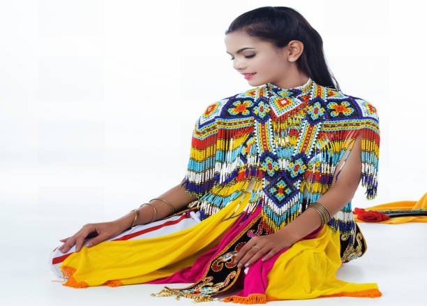 istock The lady in Southern thai classical dancing suit is posing on white background. 1072914702
