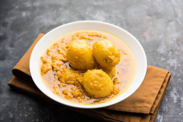 istock Indian Dum aloo curry using fried potatoes and spices, served in a bowl. selective focus 1072919718