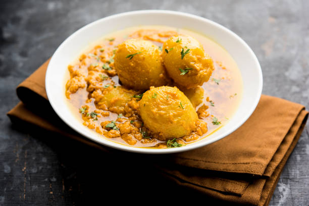 istock Indian Dum aloo curry using fried potatoes and spices, served in a bowl. selective focus 1072919764