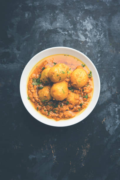 Indian Dum aloo curry using fried potatoes and spices, served in a bowl. selective focus Indian Dum aloo curry using fried potatoes and spices, served in a bowl. selective focus masala stock pictures, royalty-free photos & images