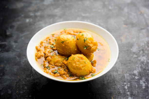 istock Indian Dum aloo curry using fried potatoes and spices, served in a bowl. selective focus 1072920898
