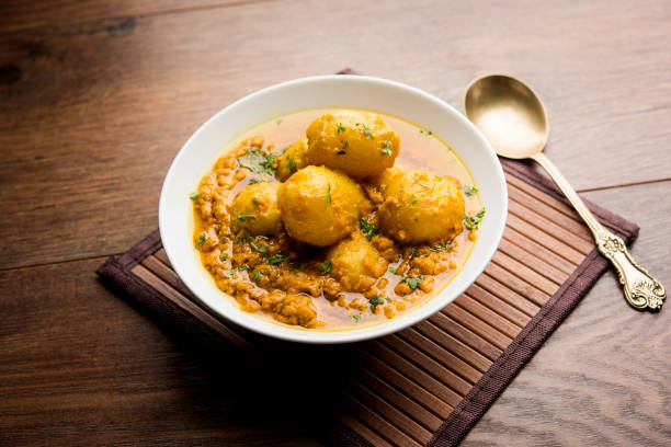 istock Indian Dum aloo curry using fried potatoes and spices, served in a bowl. selective focus 1072921462