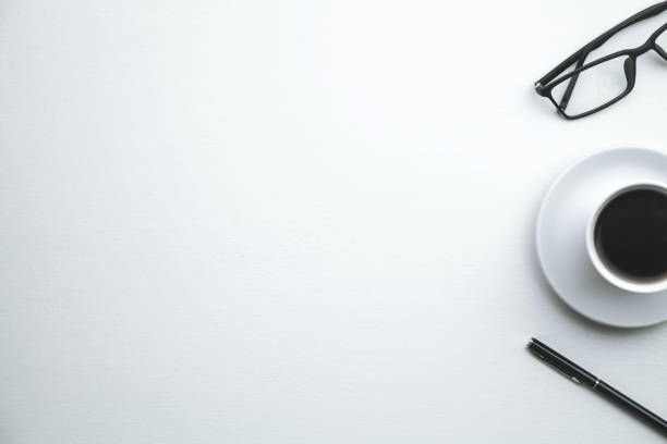 istock Coffee cup, pen and glasses on a white background. 1072921810