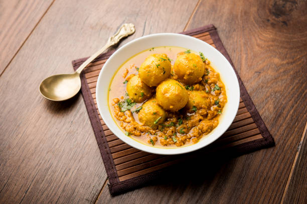 istock Indian Dum aloo curry using fried potatoes and spices, served in a bowl. selective focus 1072921826