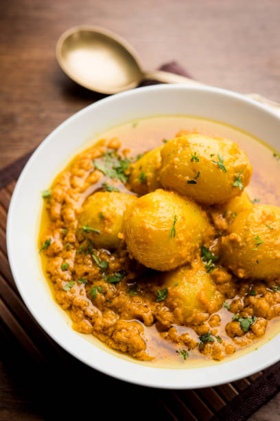 istock Indian Dum aloo curry using fried potatoes and spices, served in a bowl. selective focus 1072921956