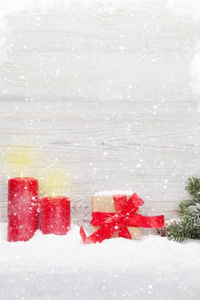istock Christmas gift box, candles and fir tree 1072927526