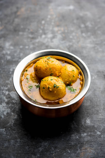 istock Indian Dum aloo curry using fried potatoes and spices, served in a bowl. selective focus 1072927940