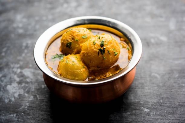 istock Indian Dum aloo curry using fried potatoes and spices, served in a bowl. selective focus 1072928192