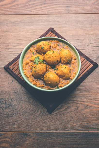 istock Indian Dum aloo curry using fried potatoes and spices, served in a bowl. selective focus 1072928218