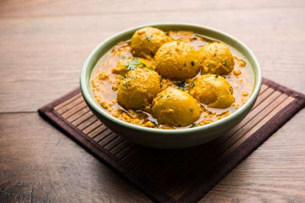 istock Indian Dum aloo curry using fried potatoes and spices, served in a bowl. selective focus 1072928346