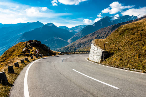 istock country road - european alps 1072929458