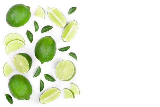 istock sliced lime vith leaves isolated on white background with copy space for your text. Top view. Flat lay pattern 1072929652
