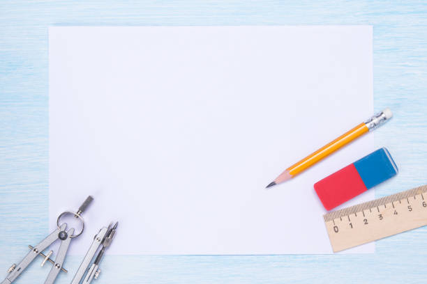 istock white sheet of drawing paper, on the table is a tool for graphics, pencil and eraser 1072932606
