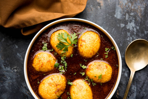 istock Fried egg curry or anda masala served in a bowl. selective focus 1072934228