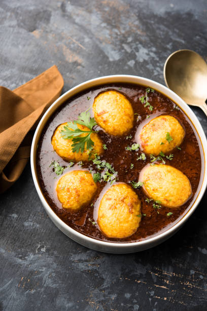 istock Fried egg curry or anda masala served in a bowl. selective focus 1072935286