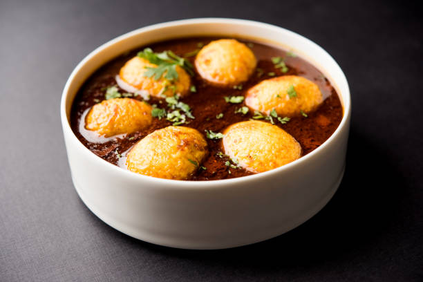 istock Fried egg curry or anda masala served in a bowl. selective focus 1072936278