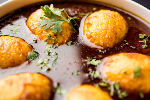 istock Fried egg curry or anda masala served in a bowl. selective focus 1072936576
