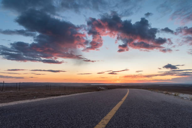 istock beautiful sunset glow and road 1072936984
