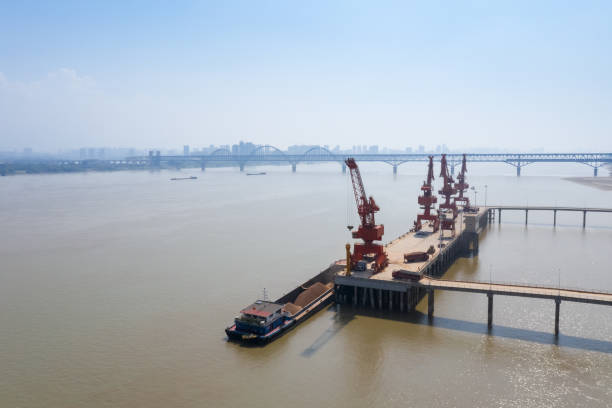 istock inland river wharf and jiujiang yangtze river bridge 1072937792