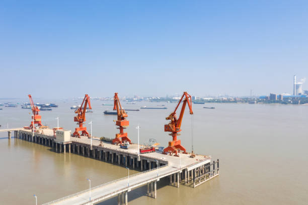 istock dock cranes and yangtze river landscape 1072938052