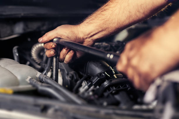istock Auto mechanic working in garage. Repair service. 1072938386