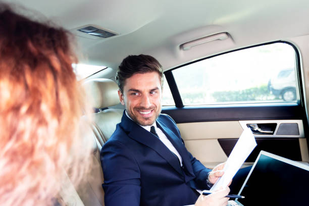 istock Successful Businessman in the car with his assistant 1072940716