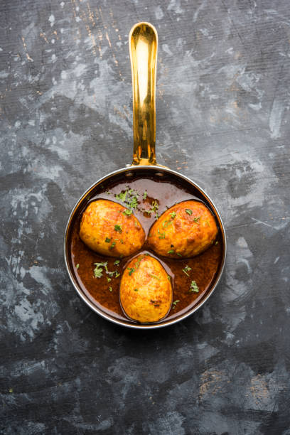 istock Fried egg curry or anda masala served in a bowl. selective focus 1072945300