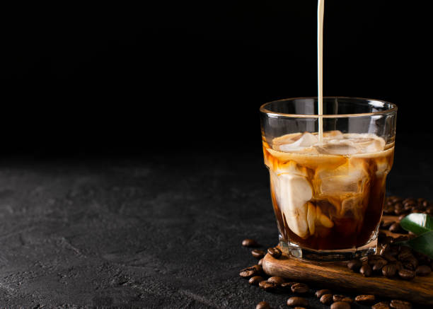 Glass Cold Brew Coffee With Ice And Milk On Black Or Dark Background Stock  Photo - Download Image Now - iStock