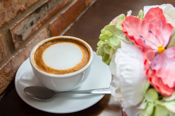 istock a cup of hot coffee in coffee shop. 1072951280
