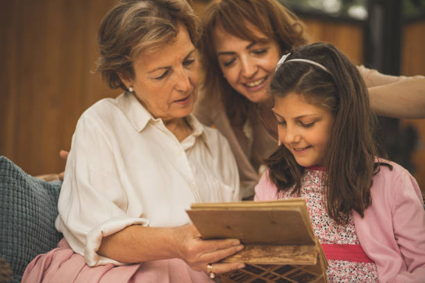 istock Grandmother showing her photos from past 1072951648