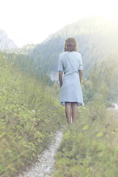 istock woman walking through uncontaminated nature 1072951694