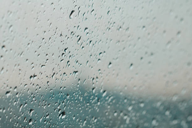 istock Raindrops on the windshield of the car. Close up, selective focus. 1072961952