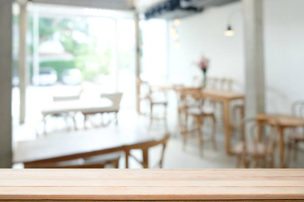istock Montage wood table and cafe blur on background. 1072962680