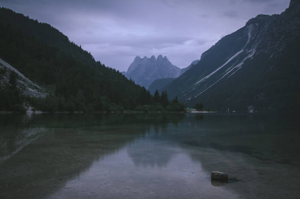 Mountain reflections at lake Predil, Italy stock photo