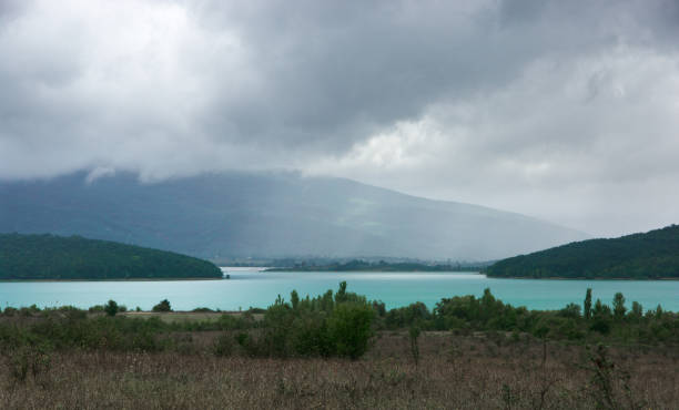 istock Lake among mountains at rainy weather 1072970388