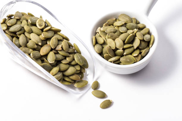 istock Pumpkin seeds in bowl 1072972680