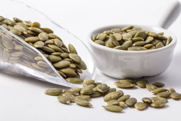 istock Pumpkin seeds in bowl 1072972684