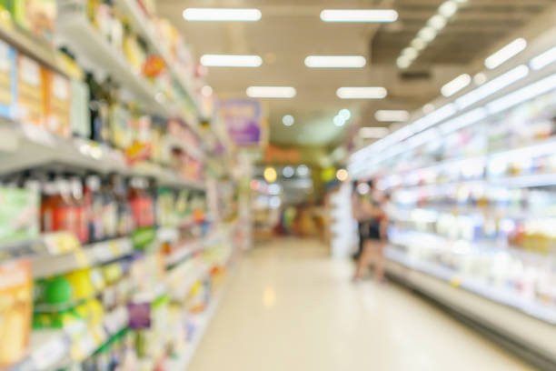 istock supermarket aisle  interior blurred defocused background with bokeh light 1072974208