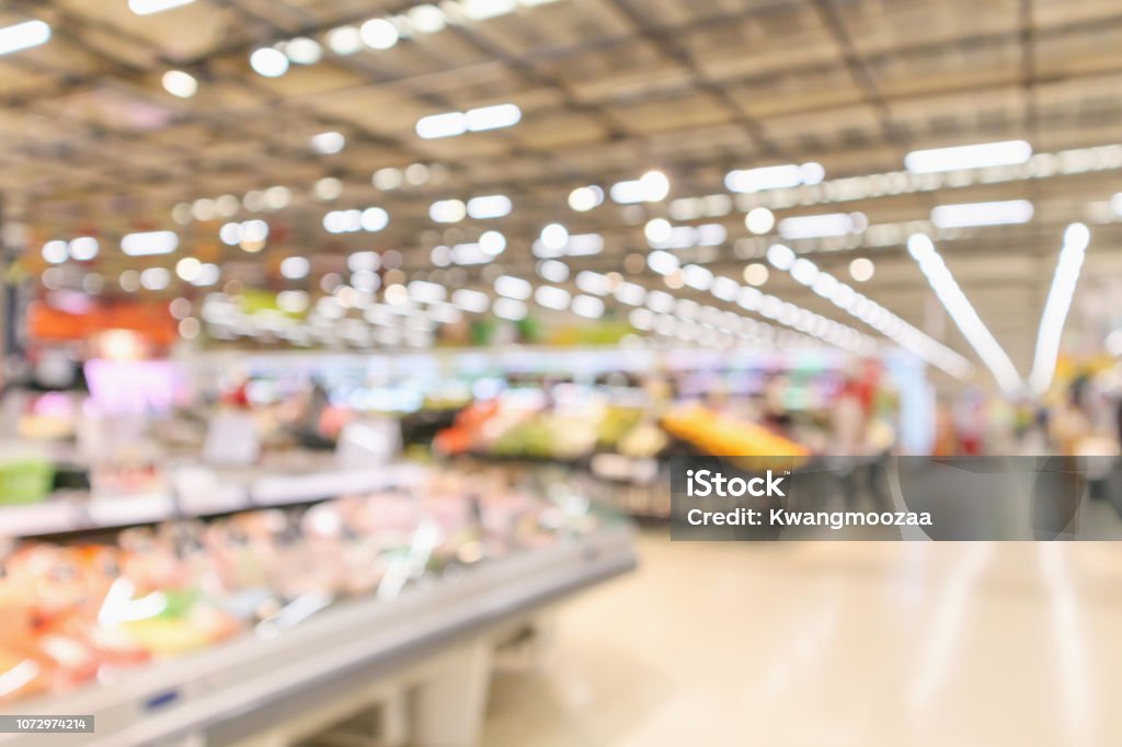 supermarket interior with grocery product blurred defocused background with bokeh light Supermarket Stock Photo