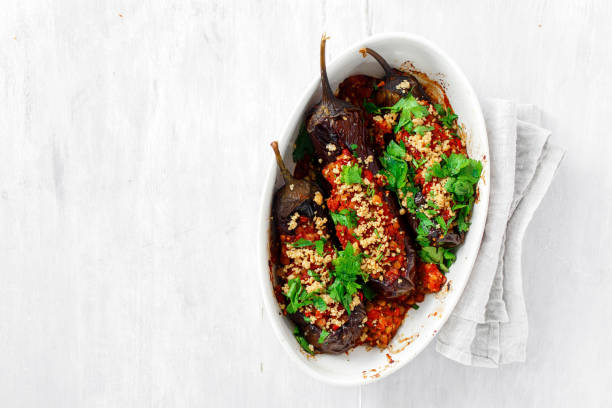 Healthy vegetarian food baked stuffed eggplant lentils copy space top view