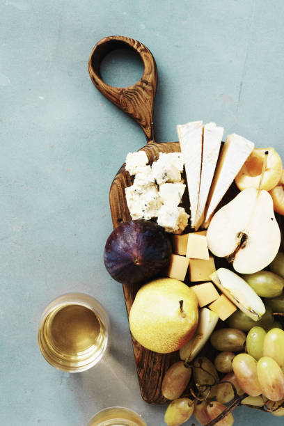 istock Appetizers table wine Fruit cheese wooden board background Wine appetizers 1072977452