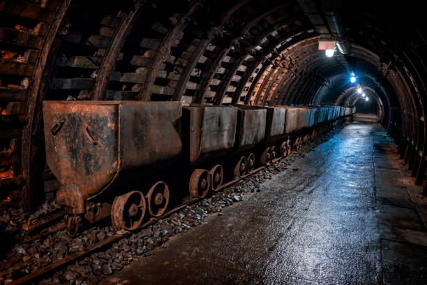 Coal mine underground corridor with freight railroad cars in an old coal mine, Walbrzych, Poland