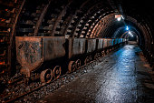 Coal mine underground corridor with freight railroad cars