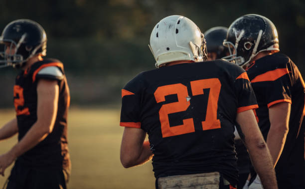 istock Football players on field 1072979250