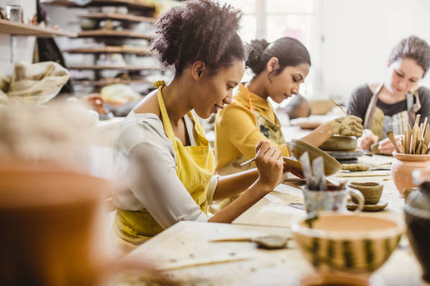 Small Group of Young People Creating Pottery