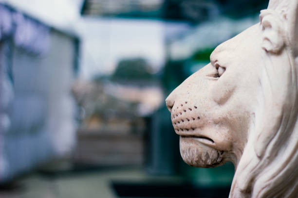 istock Sculpture of a lion's head in profile. 1072979912